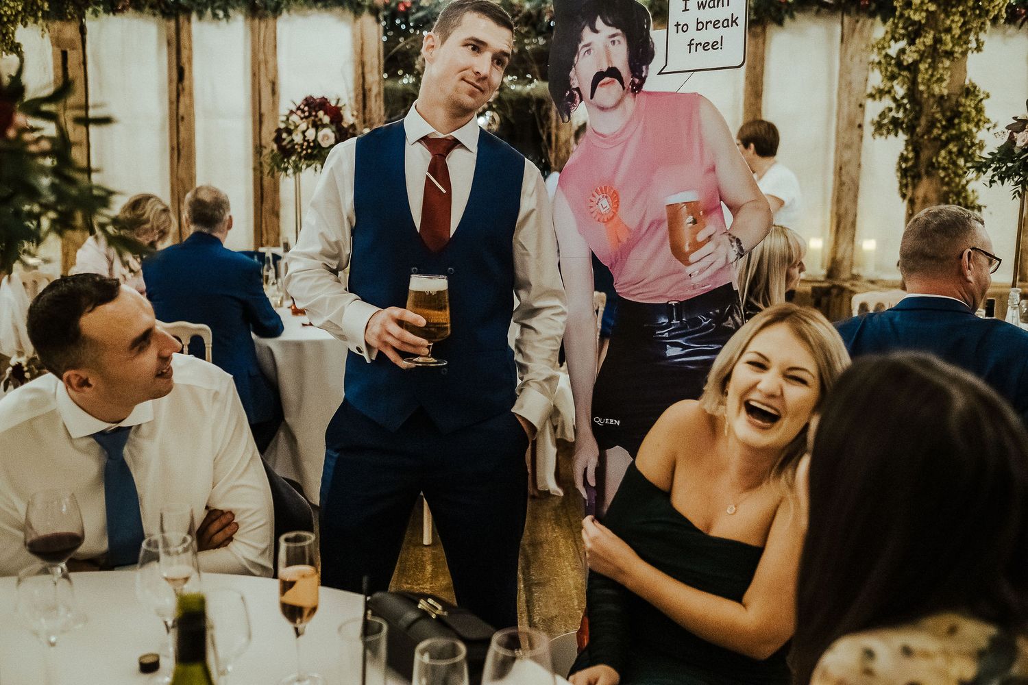 Candid shots of wedding guests laughing and celebrating against rustic backdrop.