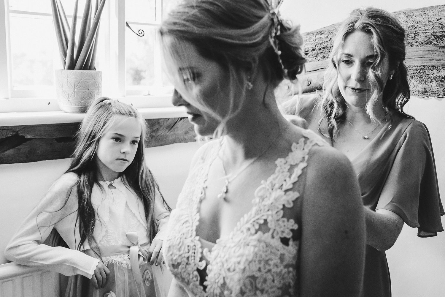 Getting ready scene with wedding preparations in a bright room.