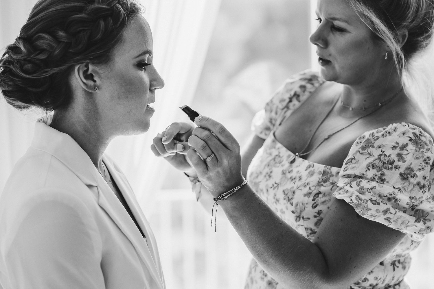 Intimate black and white series of wedding morning moments with natural window light.