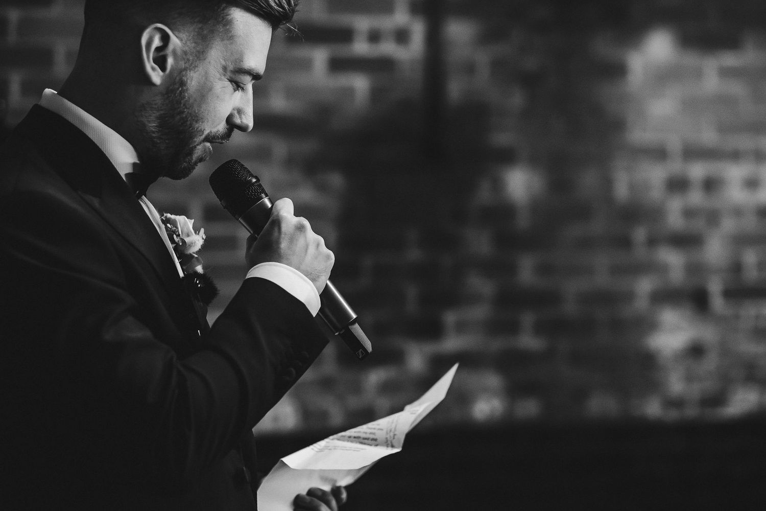 Black and white photos of wedding speeches against brick wall background.