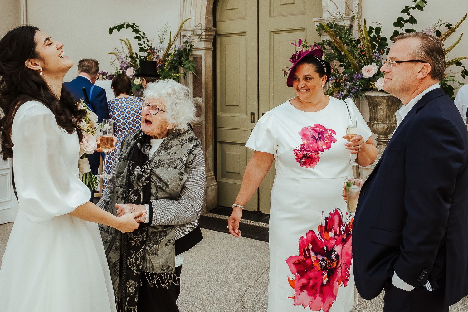 Elegant wedding ceremony moments with pink floral accents and formal attire.