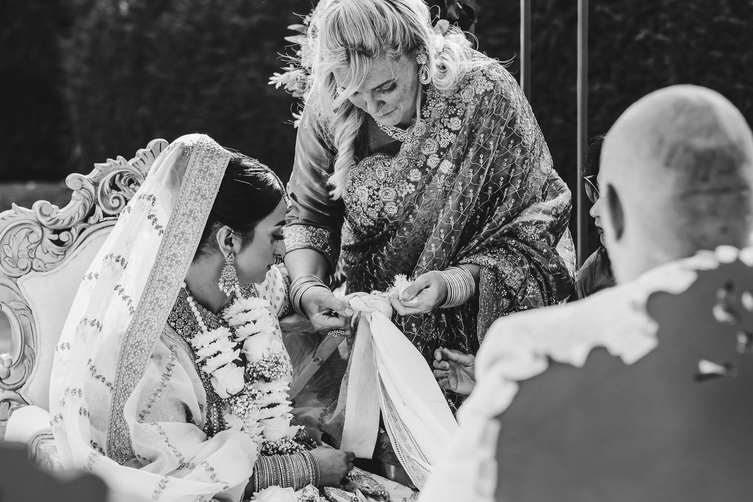 A happy couple shares a joyful moment during their wedding celebration as they exchange laughs and embraces.