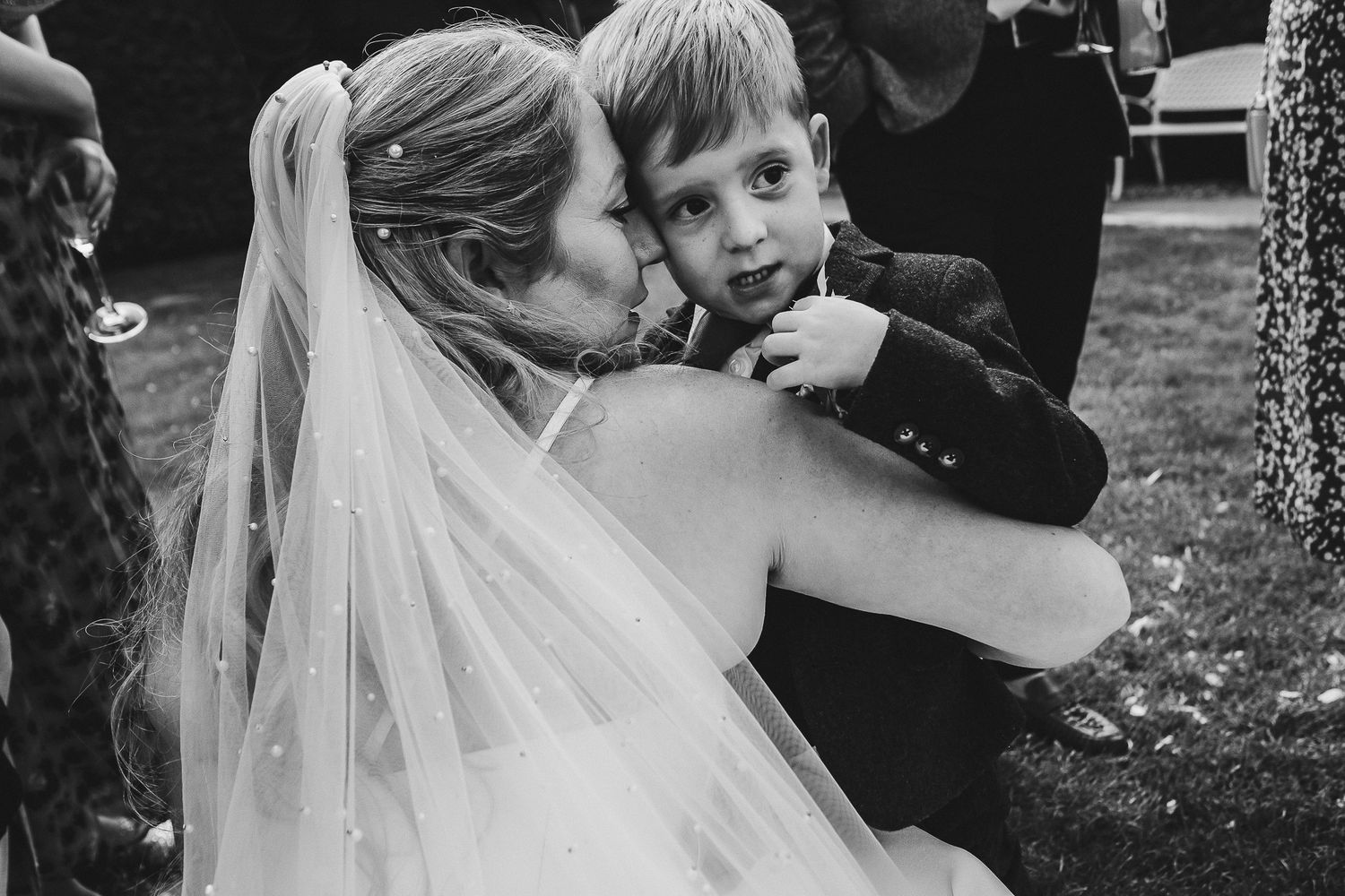 Black and white photos show intimate wedding moments during outdoor reception.