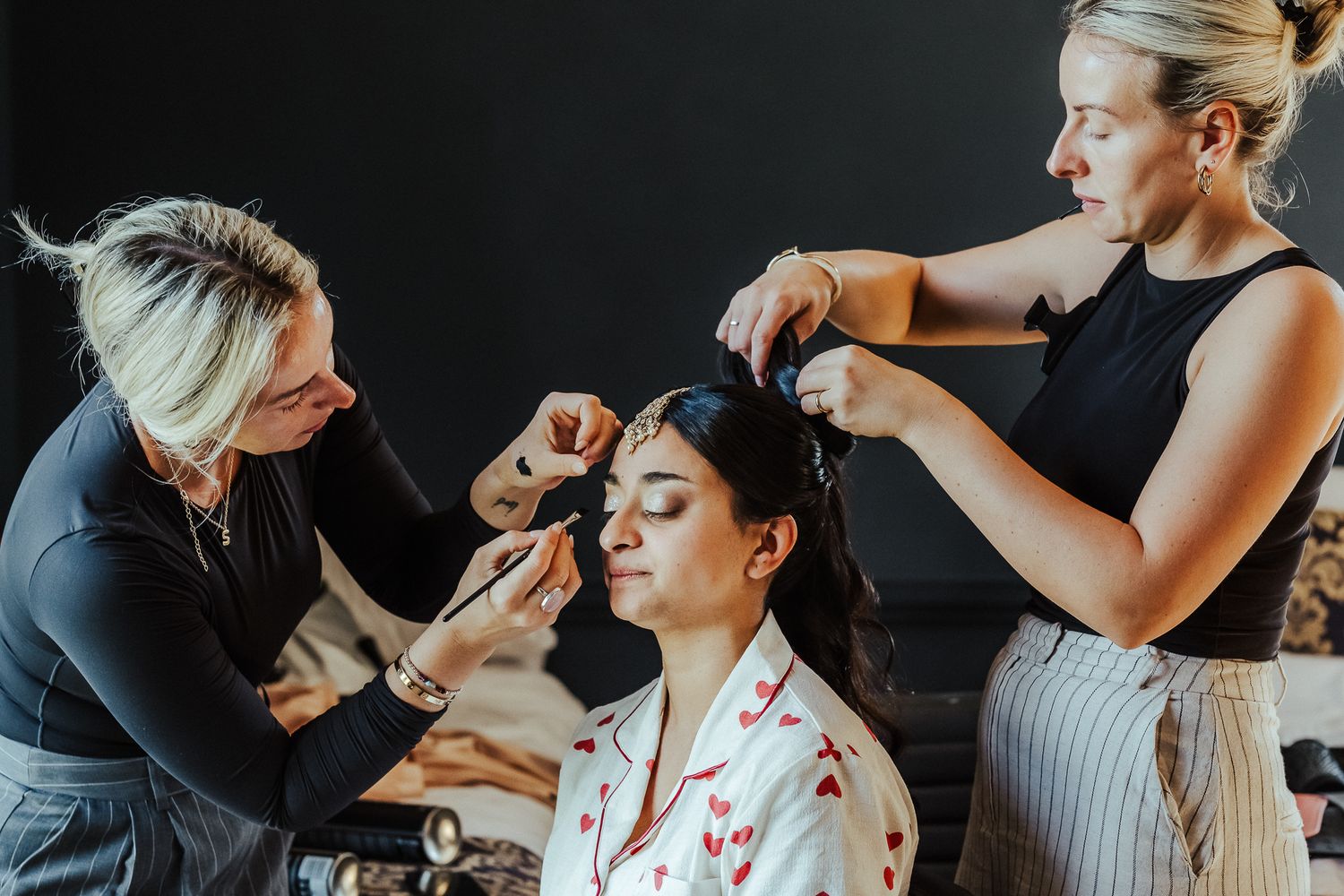 A sequence of photos showing makeup application at a professional beauty salon.