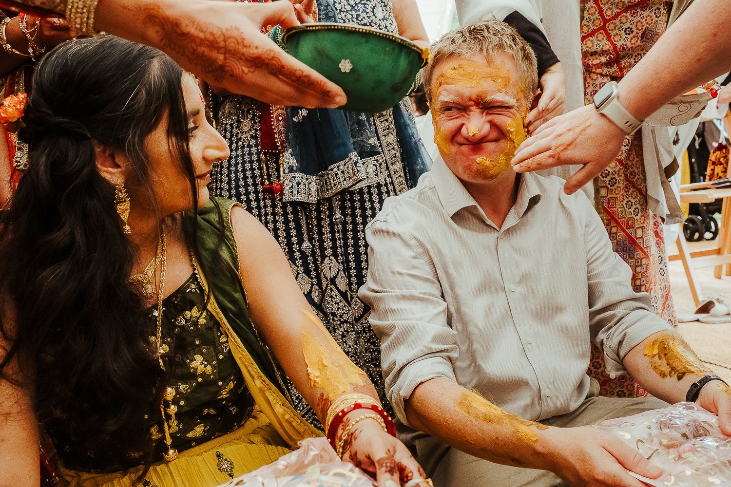 Casual wedding celebration with guests enjoying drinks and festivities.