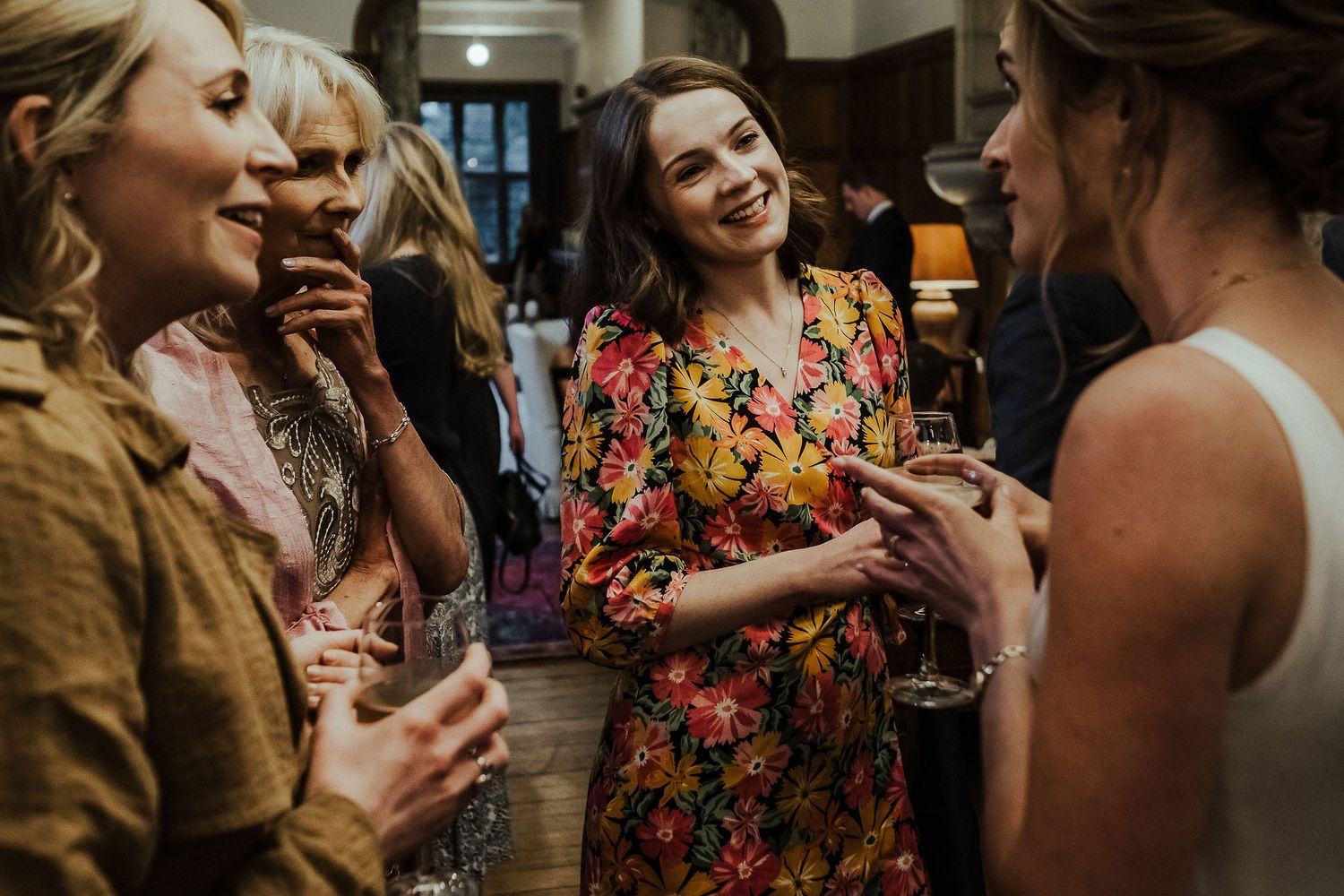 Warm-toned candid shots of guests socializing at an intimate wedding gathering.