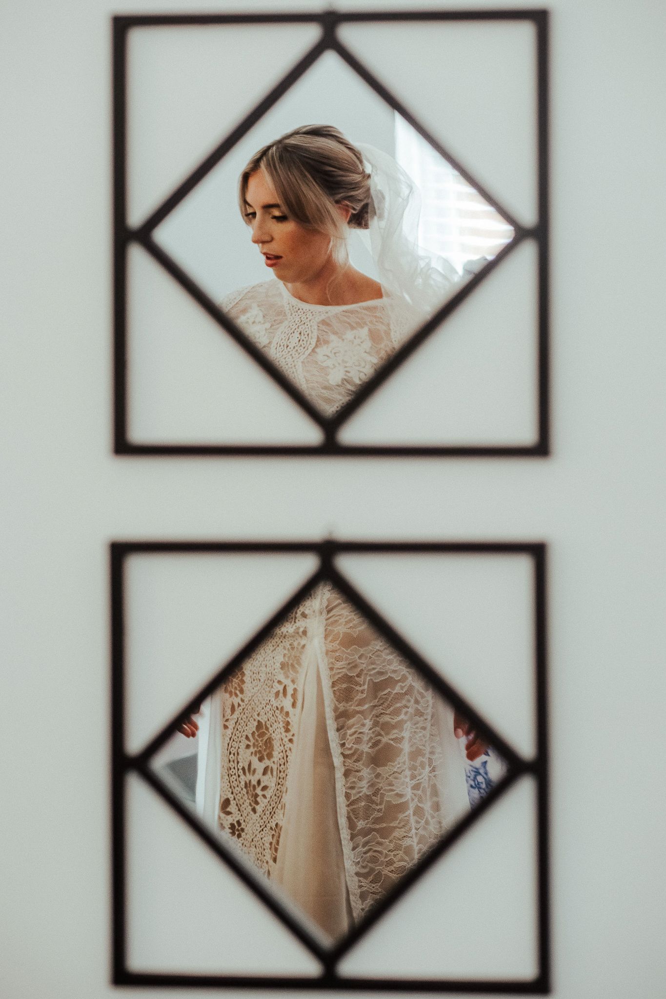 Artistic framed mirror reflections showing wedding dress details and preparations.