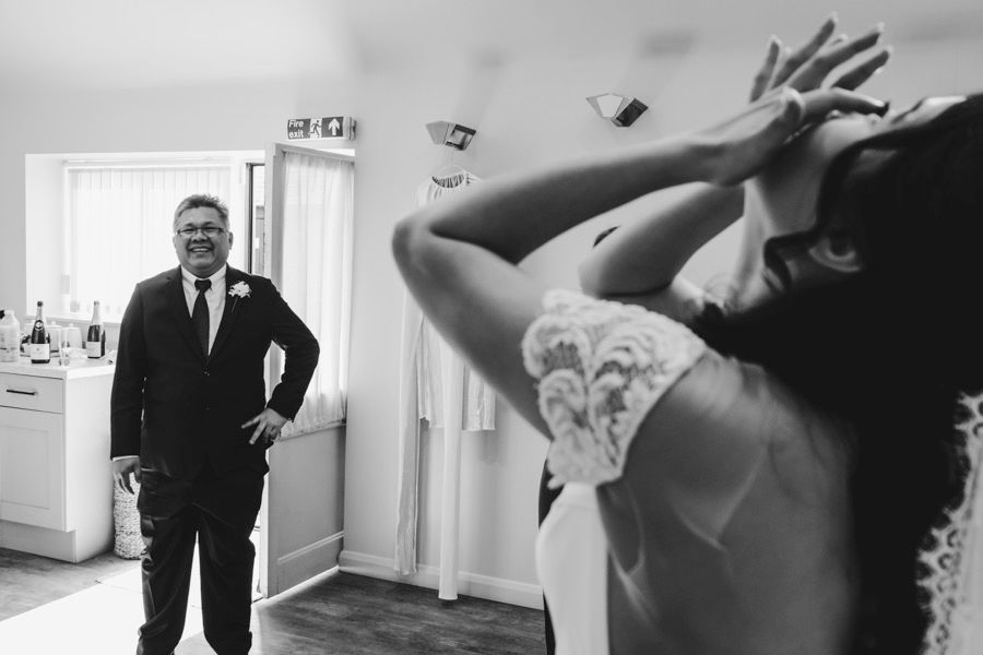 Black and white emotional wedding day moments captured in a documentary style.