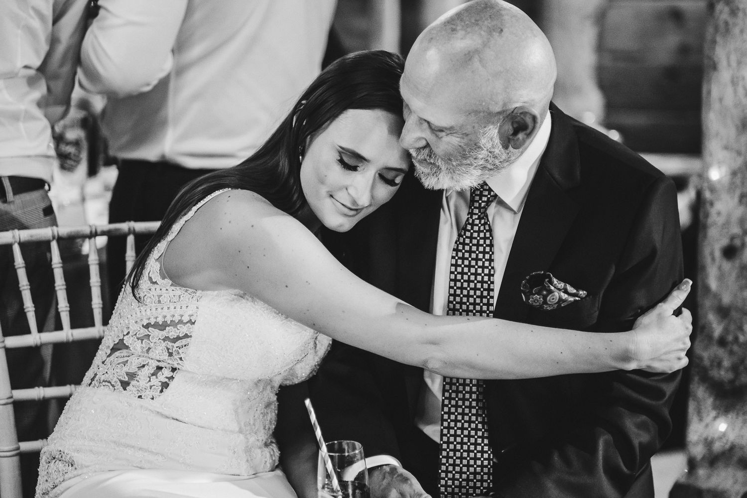 Emotional wedding celebration moments captured in black and white photography.
