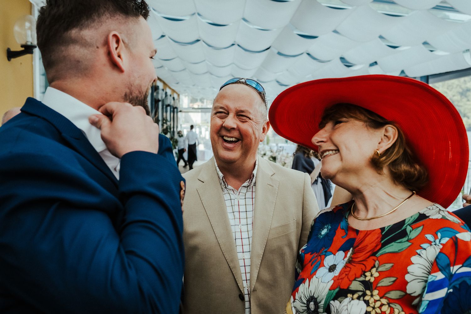 Wedding guests sharing a lighthearted moment during the celebration.