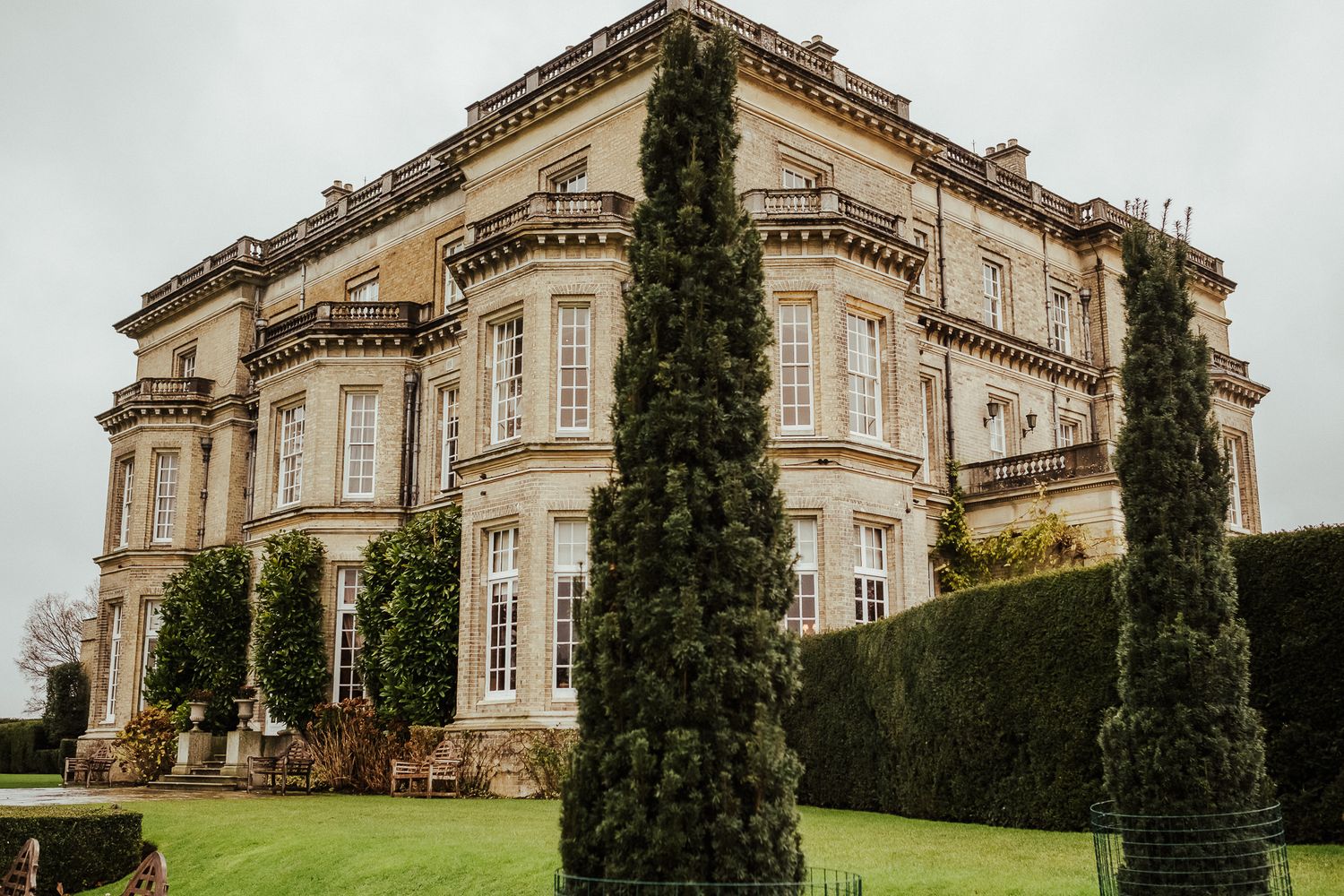 Grand historic mansion exterior with tall windows and classic architecture.