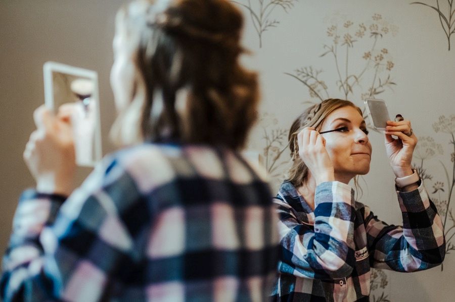 Wedding party preparation moments captured in soft natural lighting.