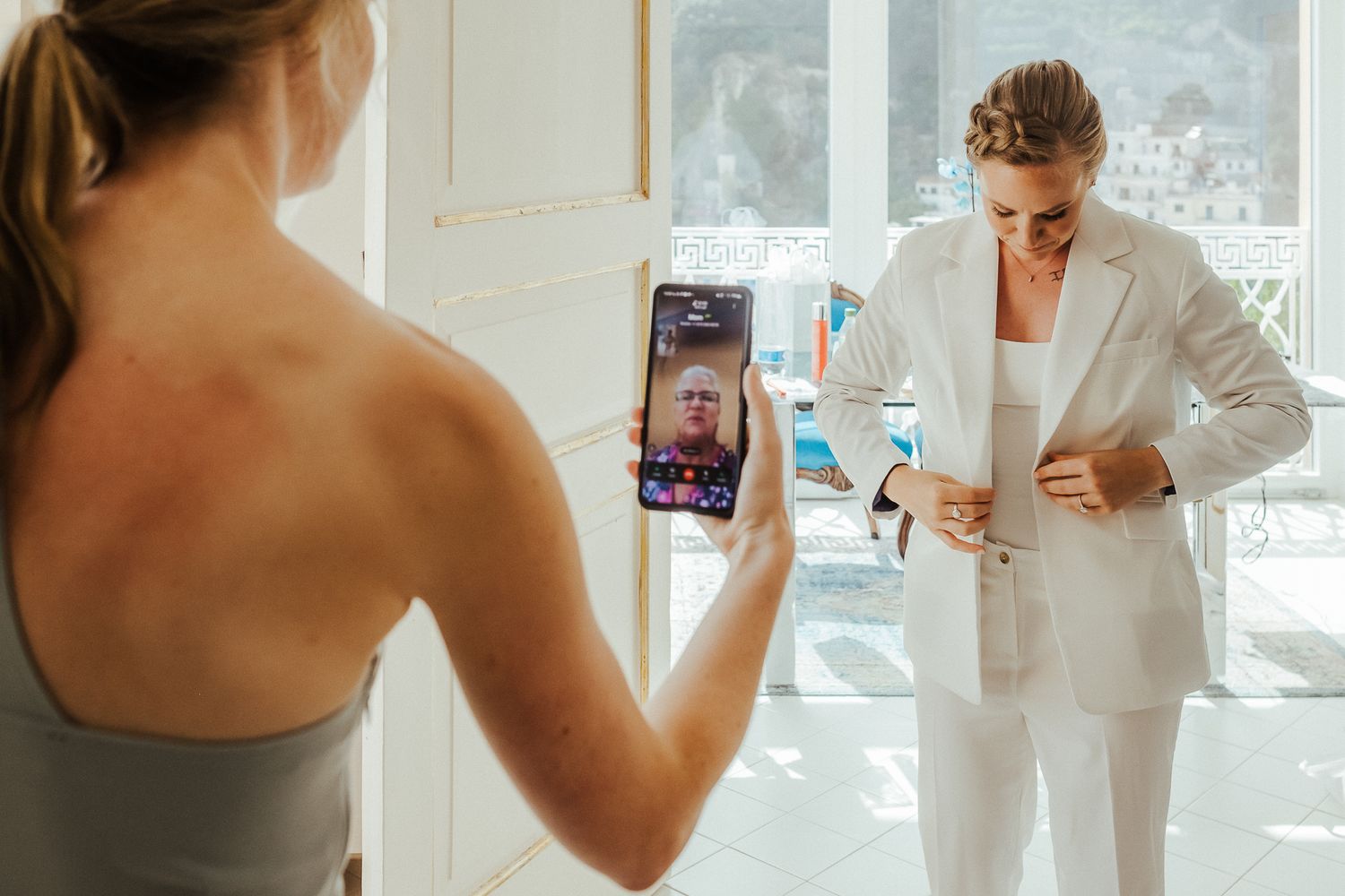 Candid wedding preparation moments captured in bright natural lighting.