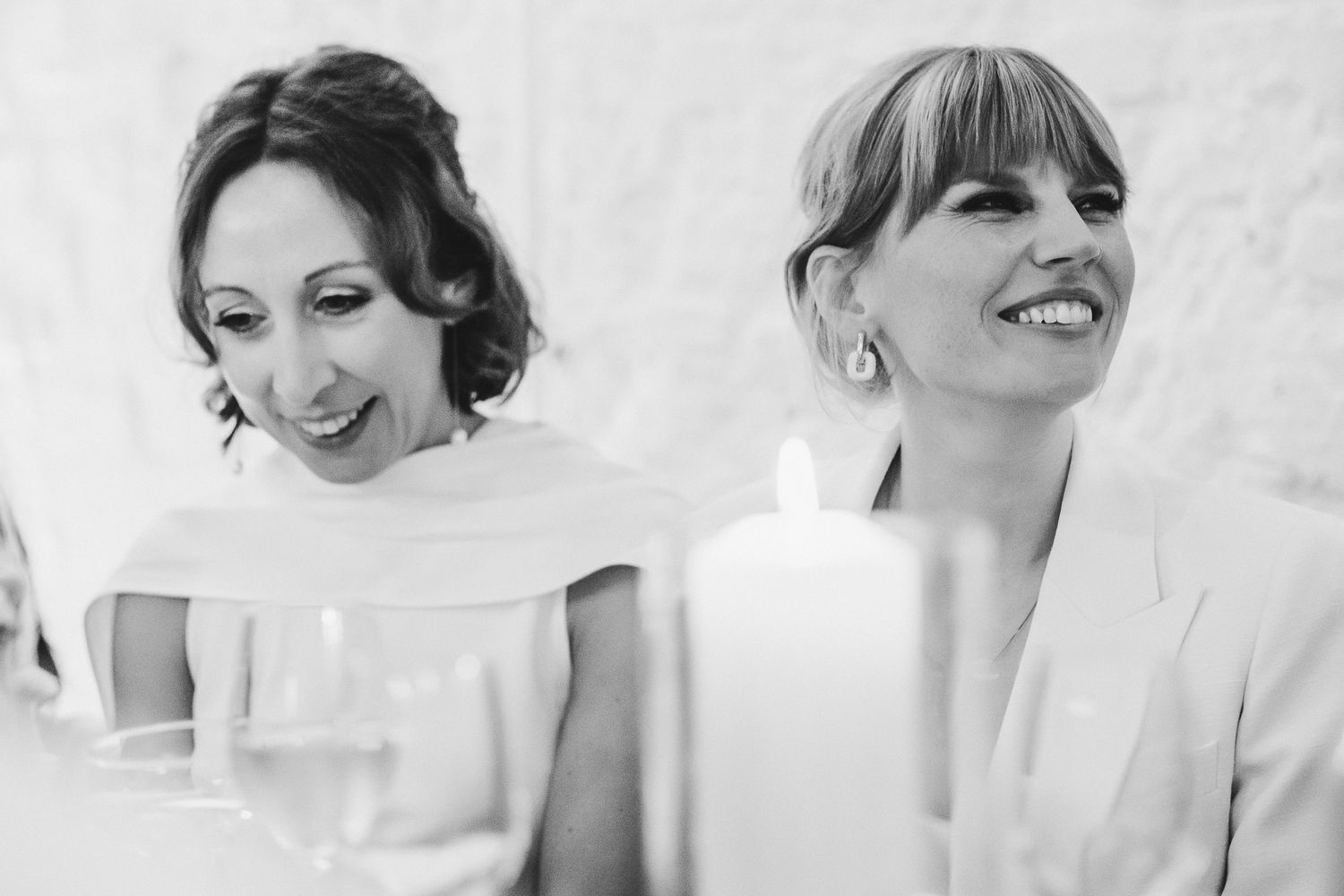 Black and white portrait showing happy moments at an elegant wedding celebration.