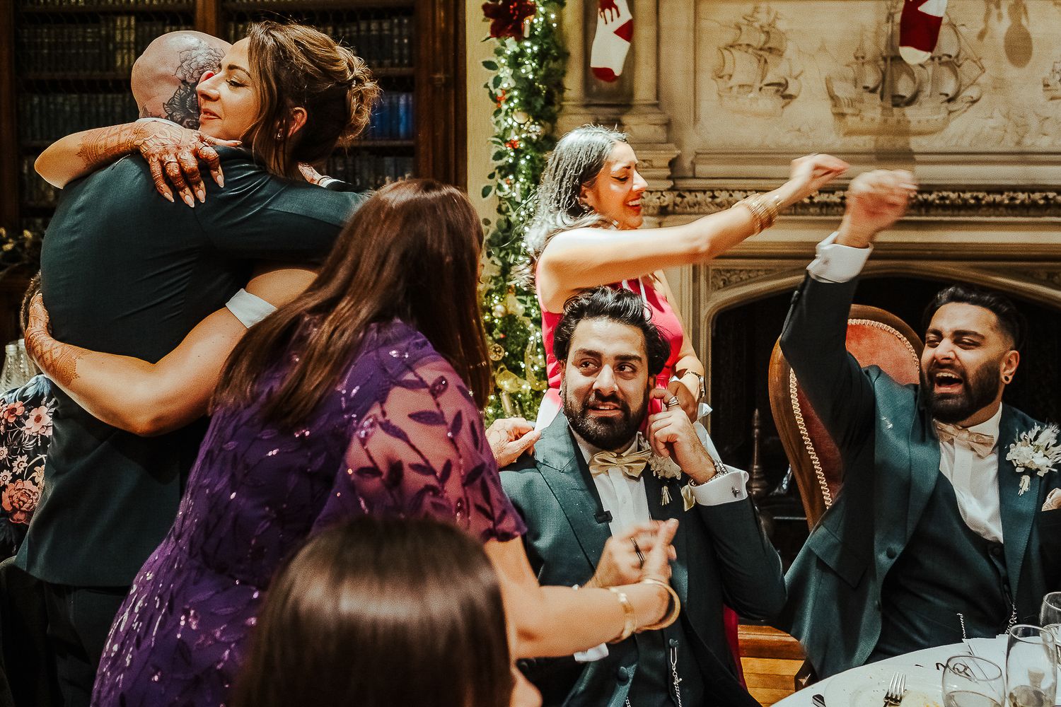 Energetic dancing and celebration captured during a wedding reception party.