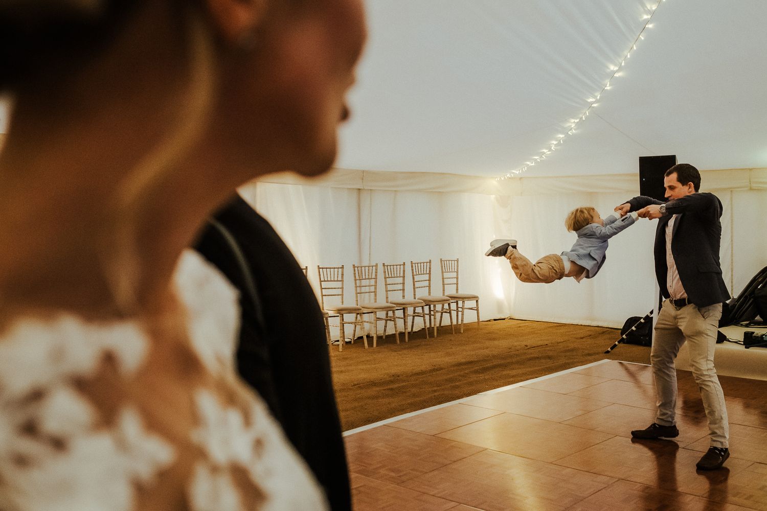 Dance floor scene with string lights creating a magical atmosphere.
