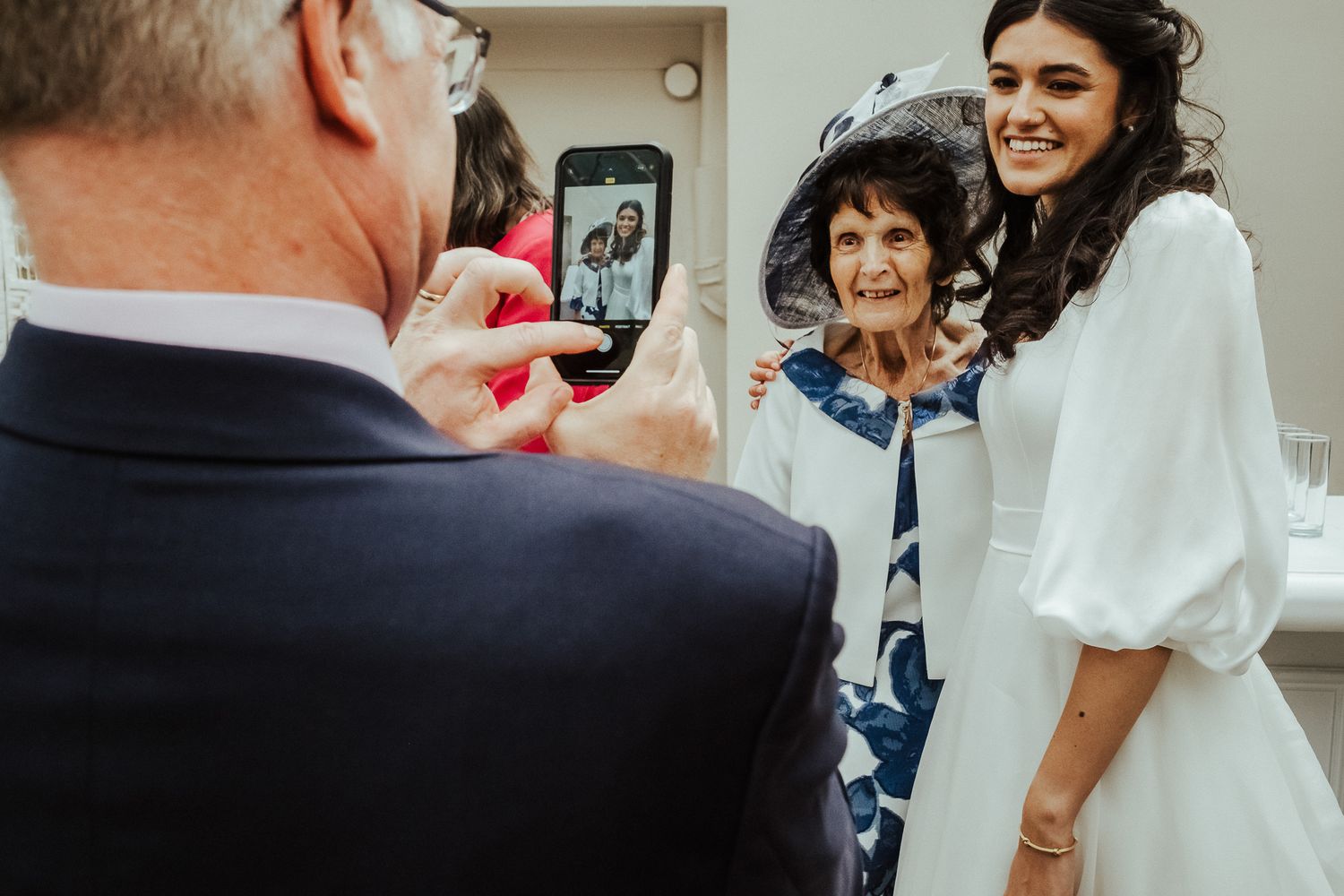 Candid wedding celebration moments captured in a sequence of casual photographs.