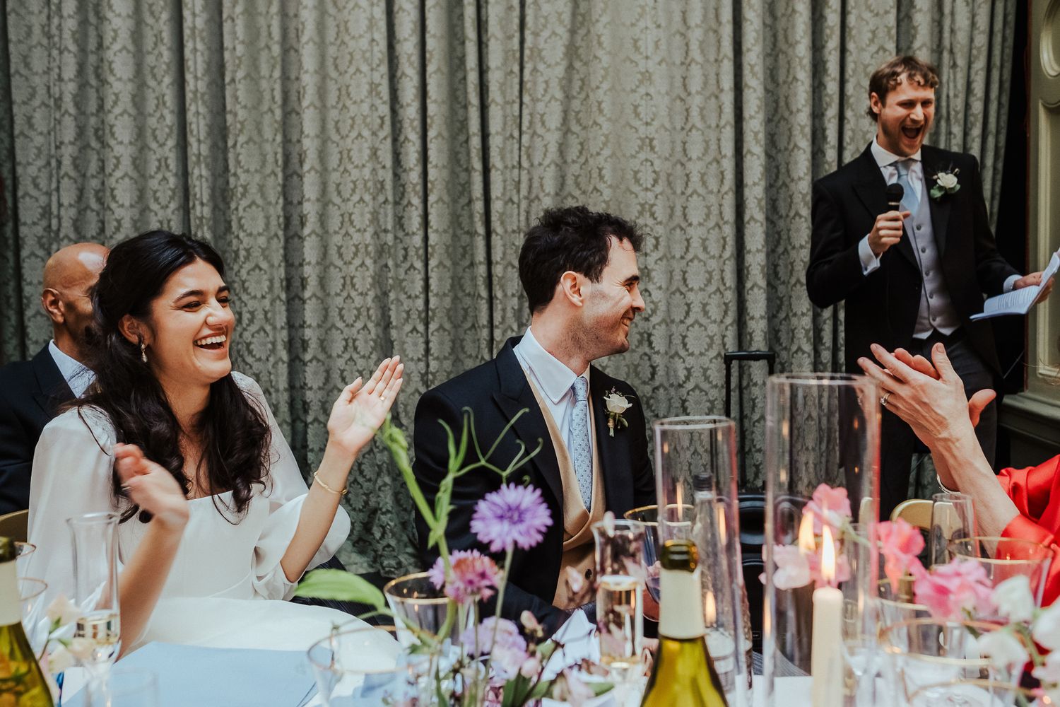 Guests enjoying an intimate moment during wedding reception festivities.