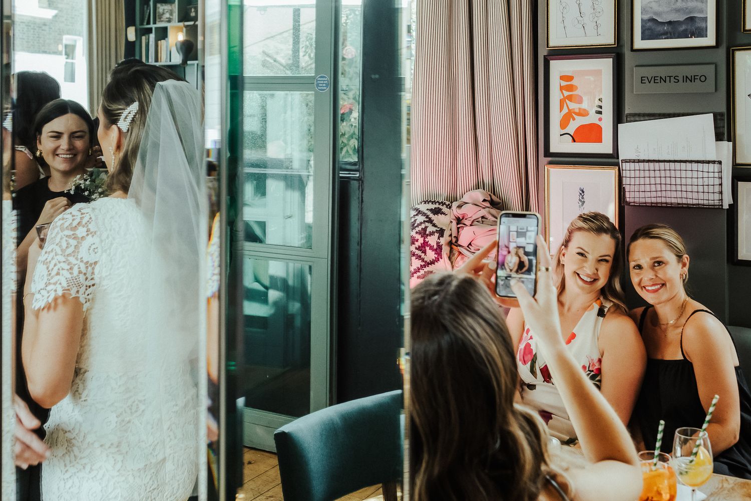 Wedding party toasts with champagne glasses during celebration at indoor venue.