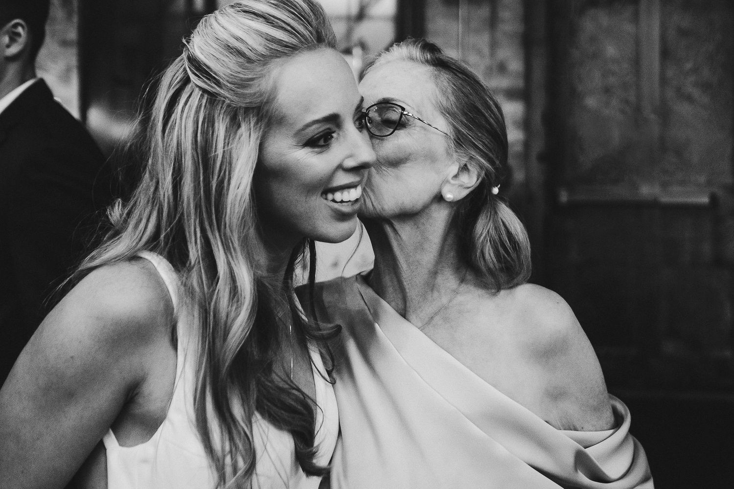 Black and white candid shots capture joyful moments at a celebratory event.
