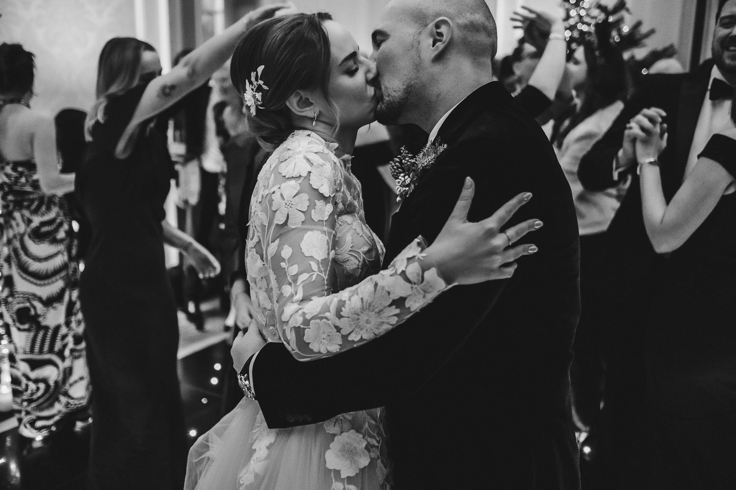 Romantic black and white moments captured during wedding reception celebrations.