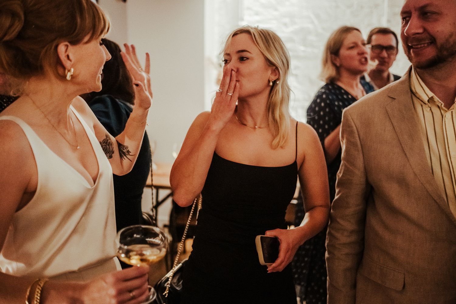 Guests mingling and socializing during an intimate wedding reception.