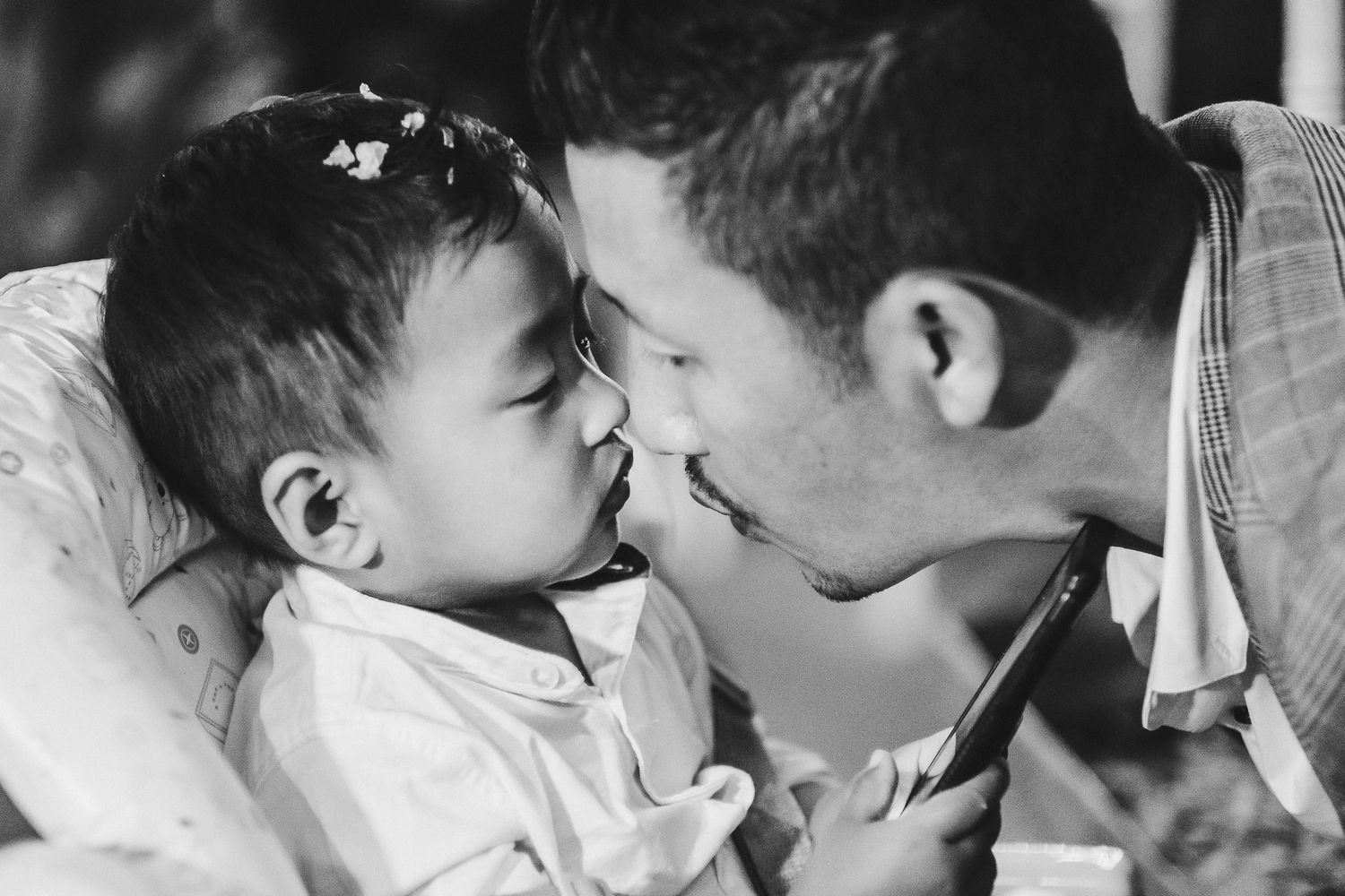 Tender black and white intimate moment shared between loved ones.