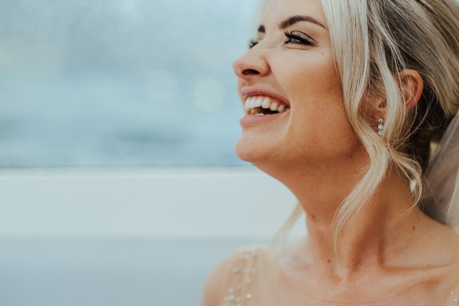 Close-up profile portrait with natural light and soft bokeh background.