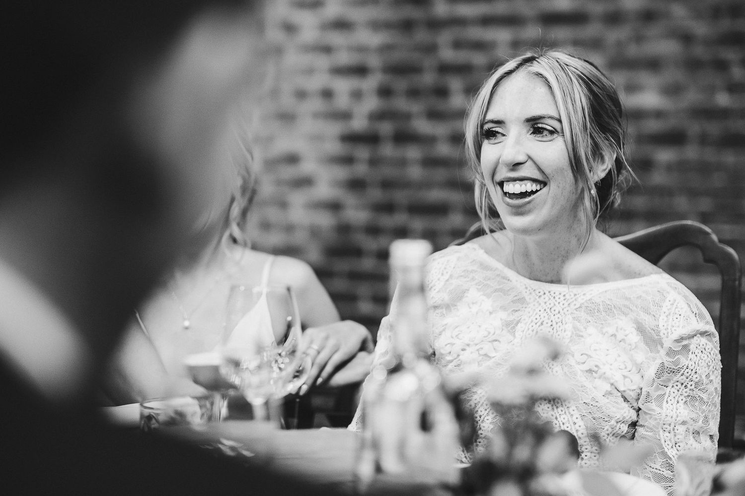 Candid expressions of joy and laughter during wedding celebration.