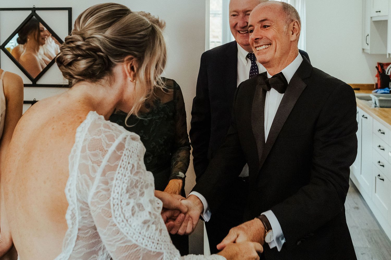 Candid pre-wedding moments captured with natural light showing interactions during preparations.
