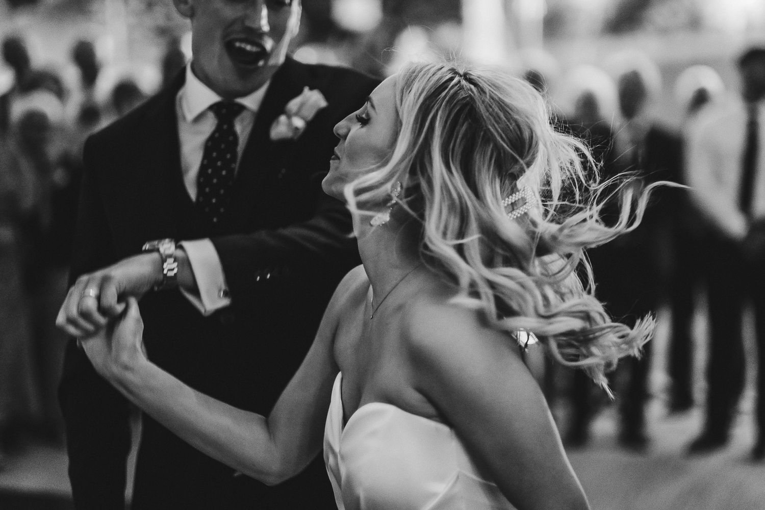 Black and white photos of couples dancing at an elegant reception.