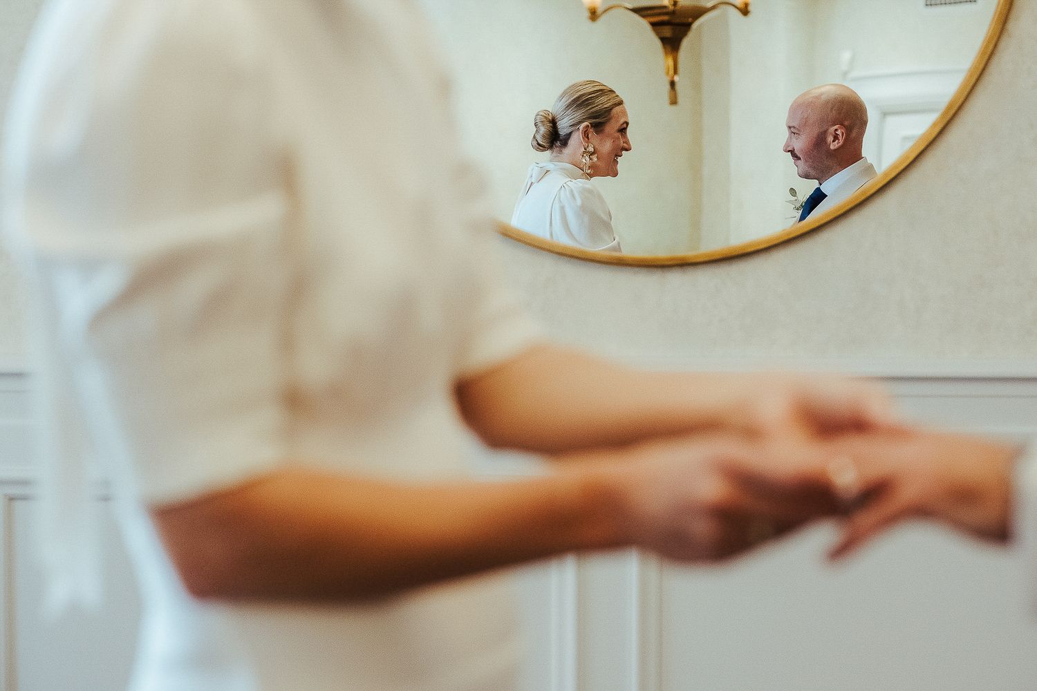 Intimate wedding ceremony moments captured in soft focus with elegant decor.