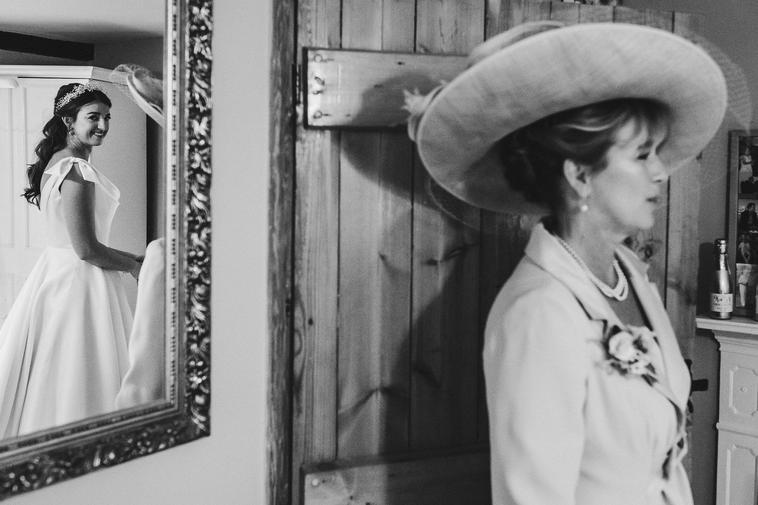 Vintage black and white photographs showing wedding dress preparations.