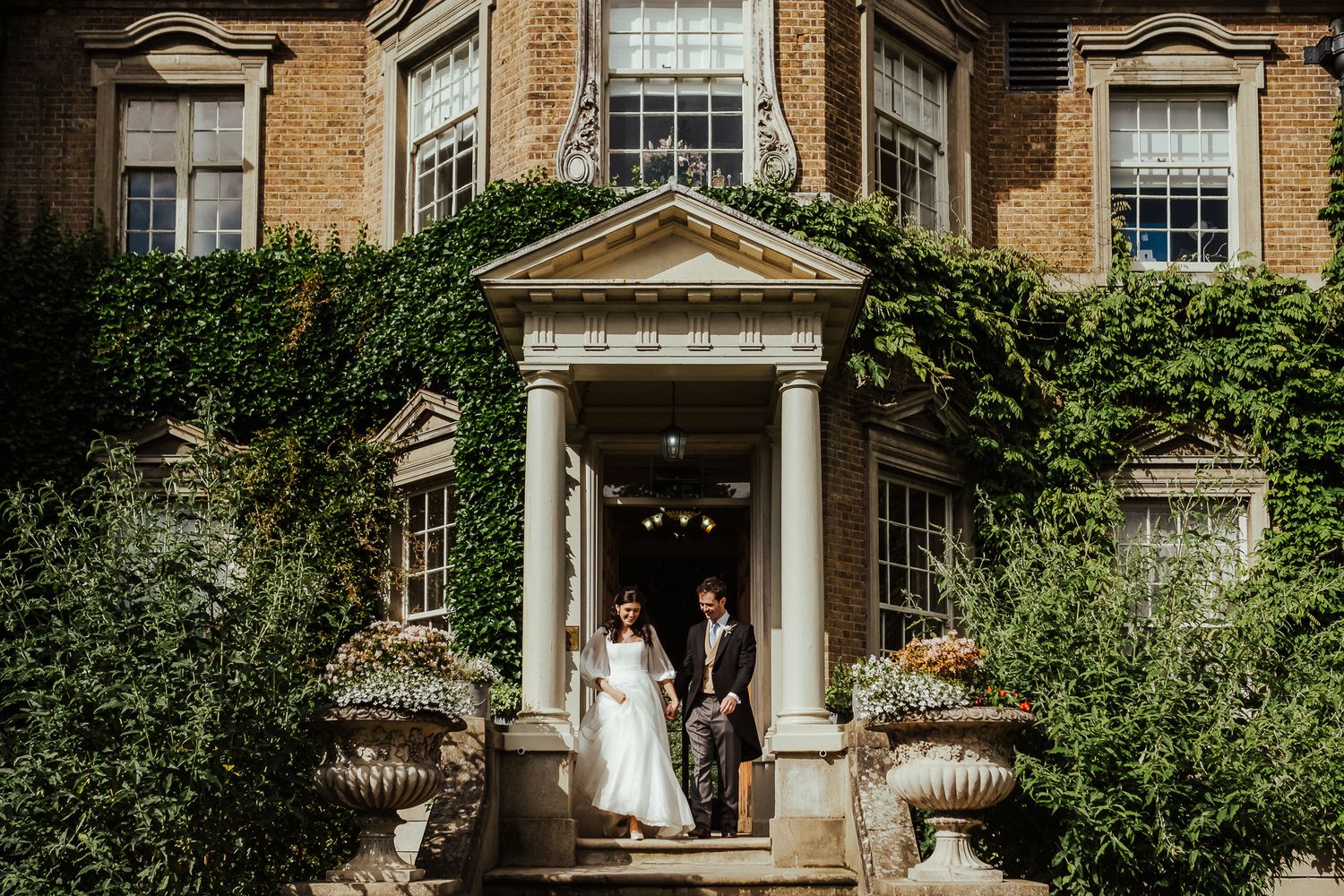 Grand architectural details of a historic wedding venue with columned entrance.