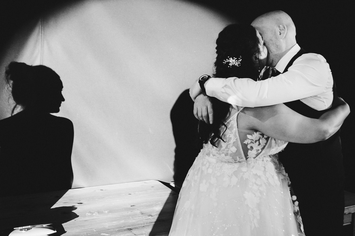Couples slow dancing together at an elegant wedding reception in black and white.