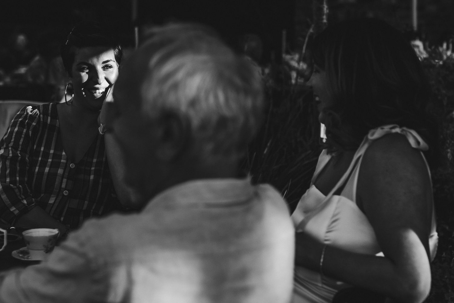 Intimate dance floor moments captured in dramatic black and white photography.