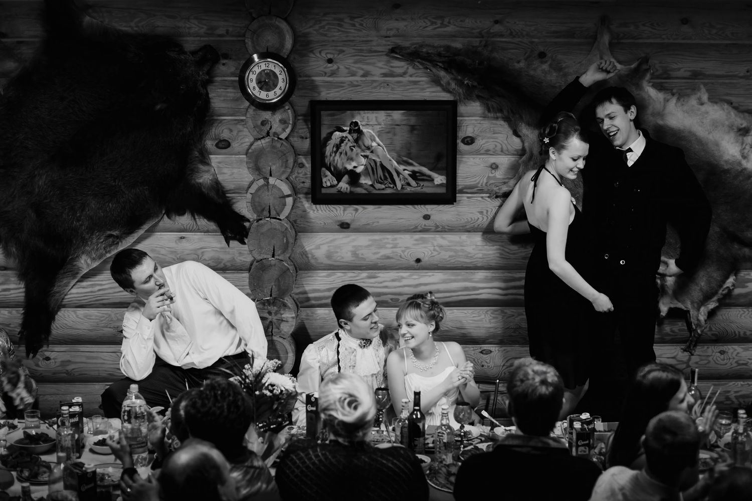 Black and white photo of candid moment during rustic wedding reception in Oshawa, Ontario