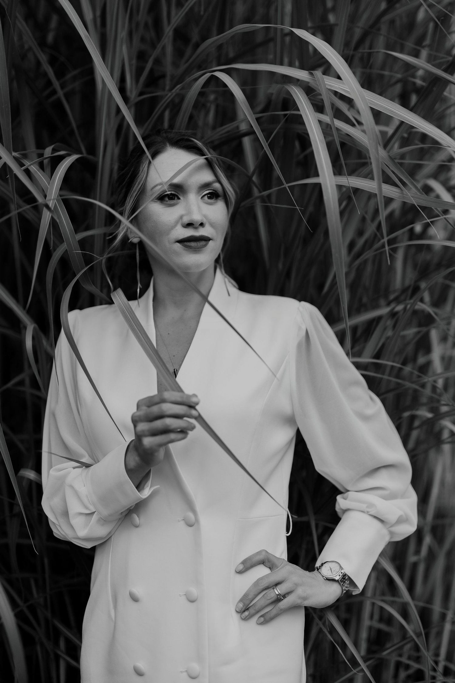 Fashion-forward black and white portrait of woman in white blazer dress in Toronto