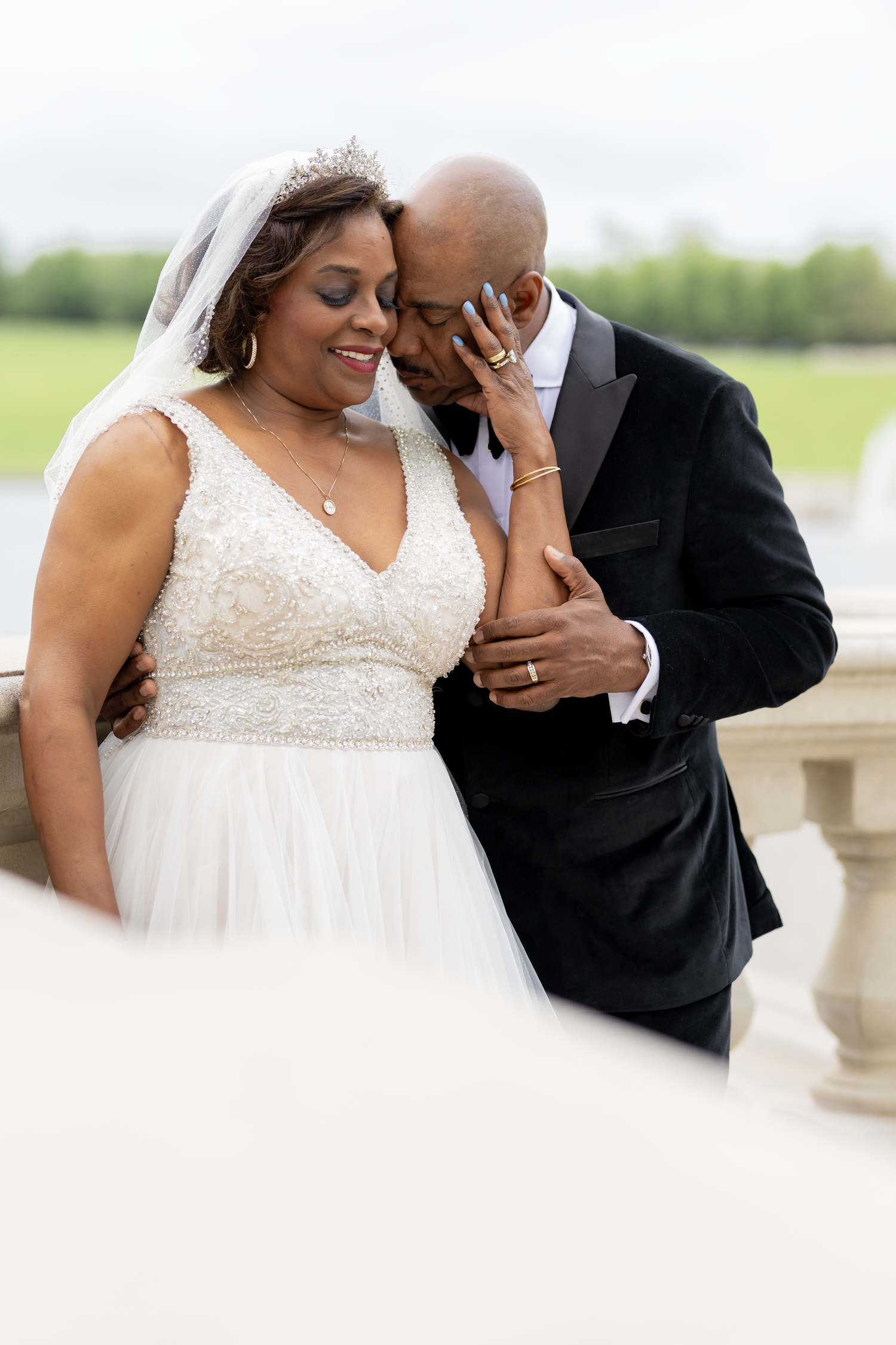 A joyful wedding portrait of newlyweds sharing a sweet moment on their special day.