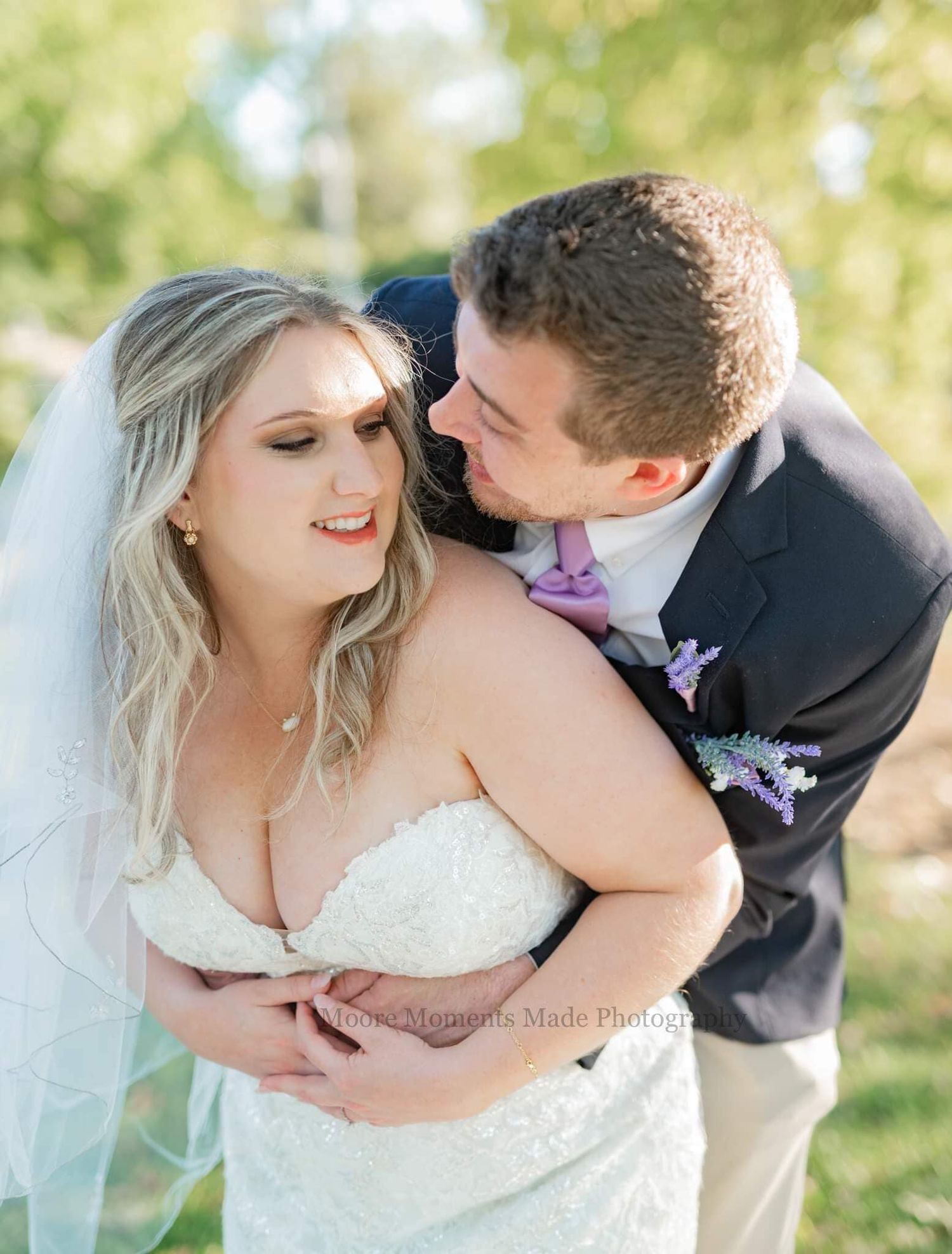 Intimate moment between newlyweds during outdoor autumn wedding photoshoot.