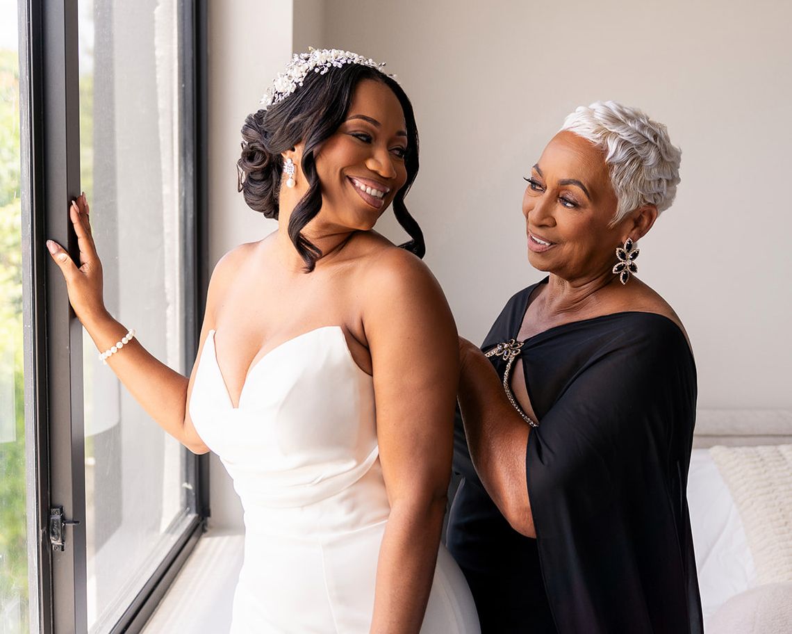 Four candid photos of two people interacting joyfully near a window in an indoor setting.