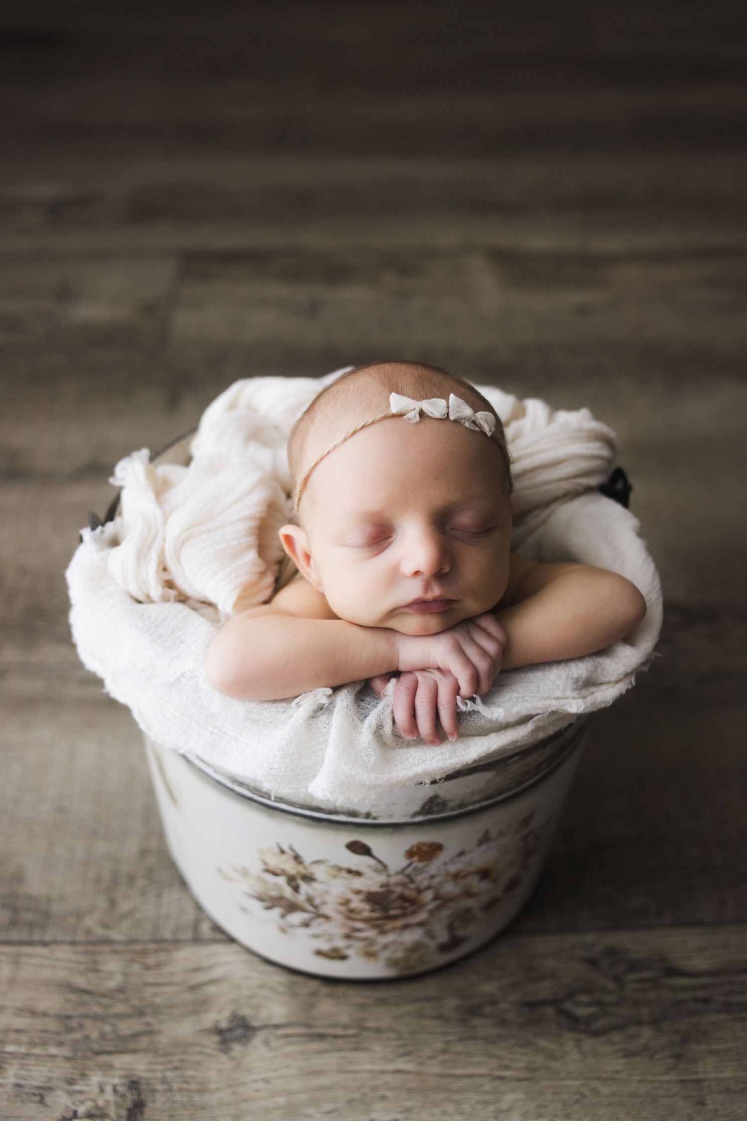 Springfield MO newborn photographer – sleeping baby wrapped in white cloth in vintage floral basin by Fairchild Photo Co