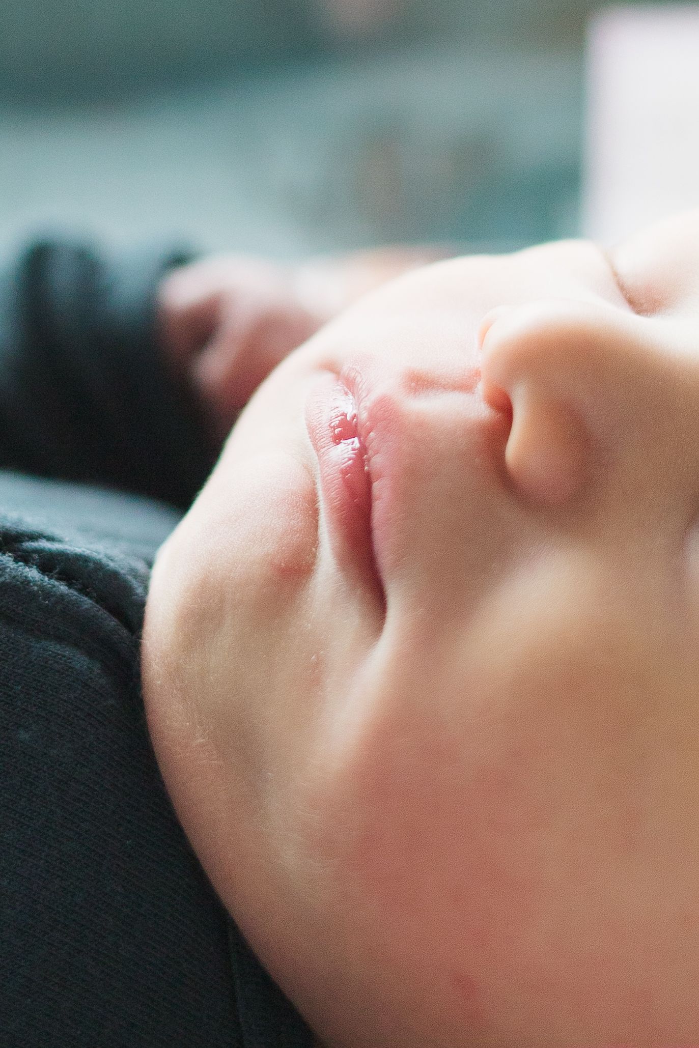 Close-up portrait of sleeping infant's face showing delicate features.
