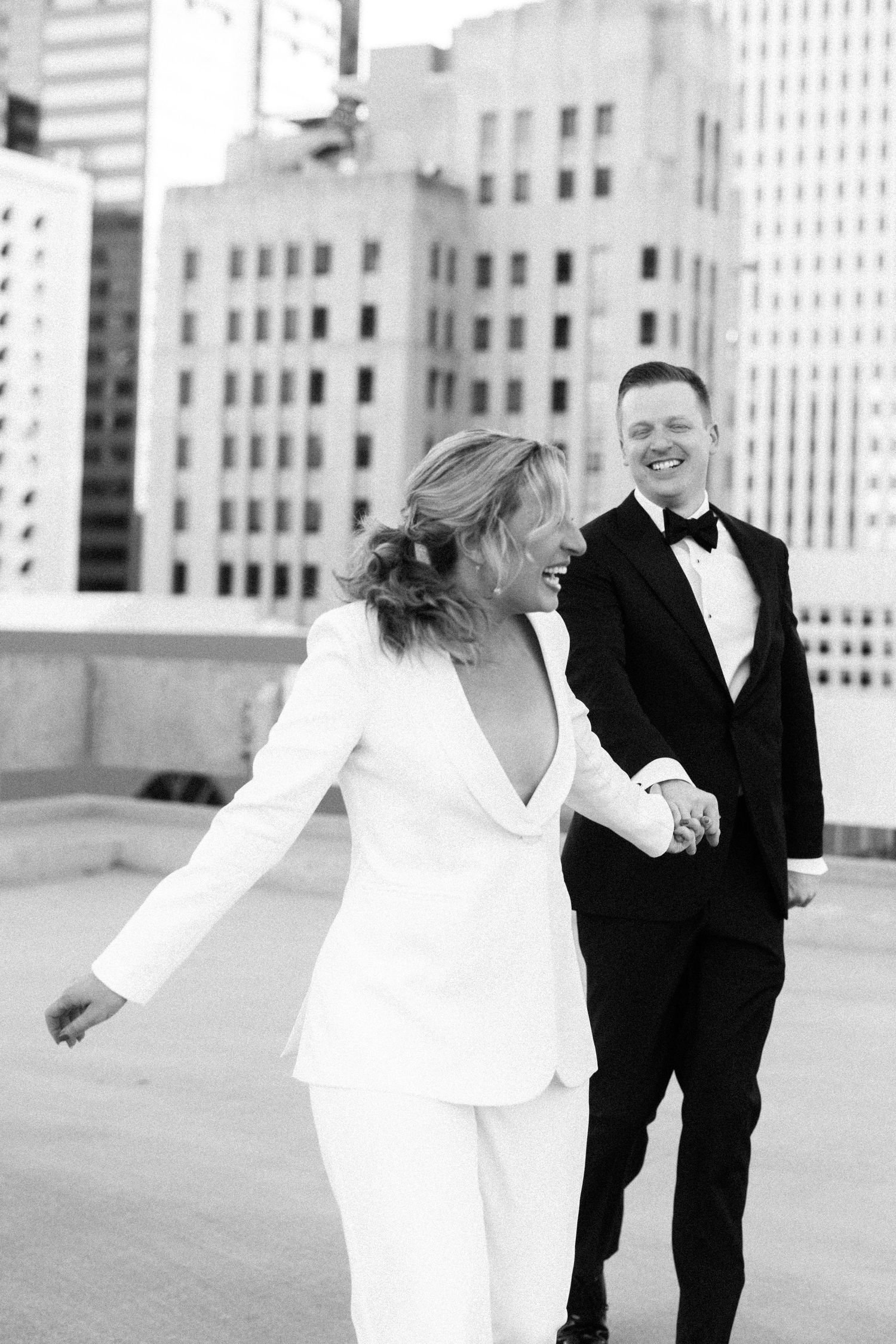 Black and white urban wedding portrait with city buildings in background. Downtown Phoenix AZ Molly McPhoto