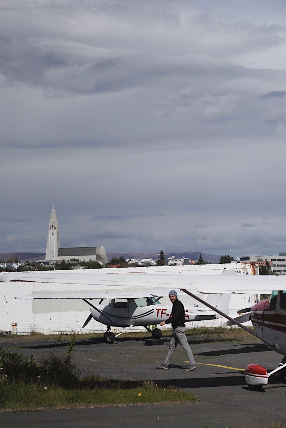 Potrait of man on airfield in reykjavik by Love & Lava Photo