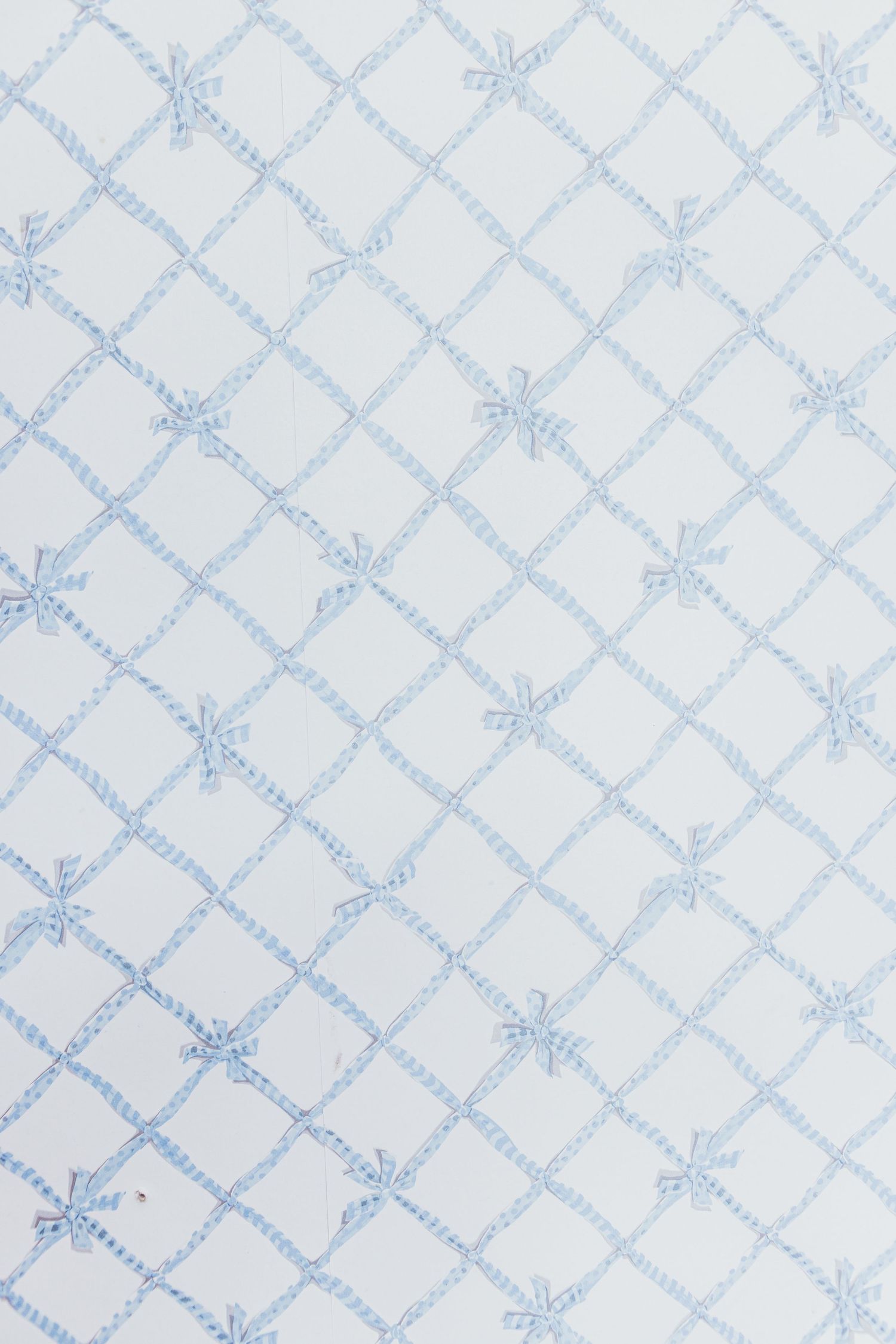 Delicate light blue floral diamond pattern wallpaper with small flower details on a white background.