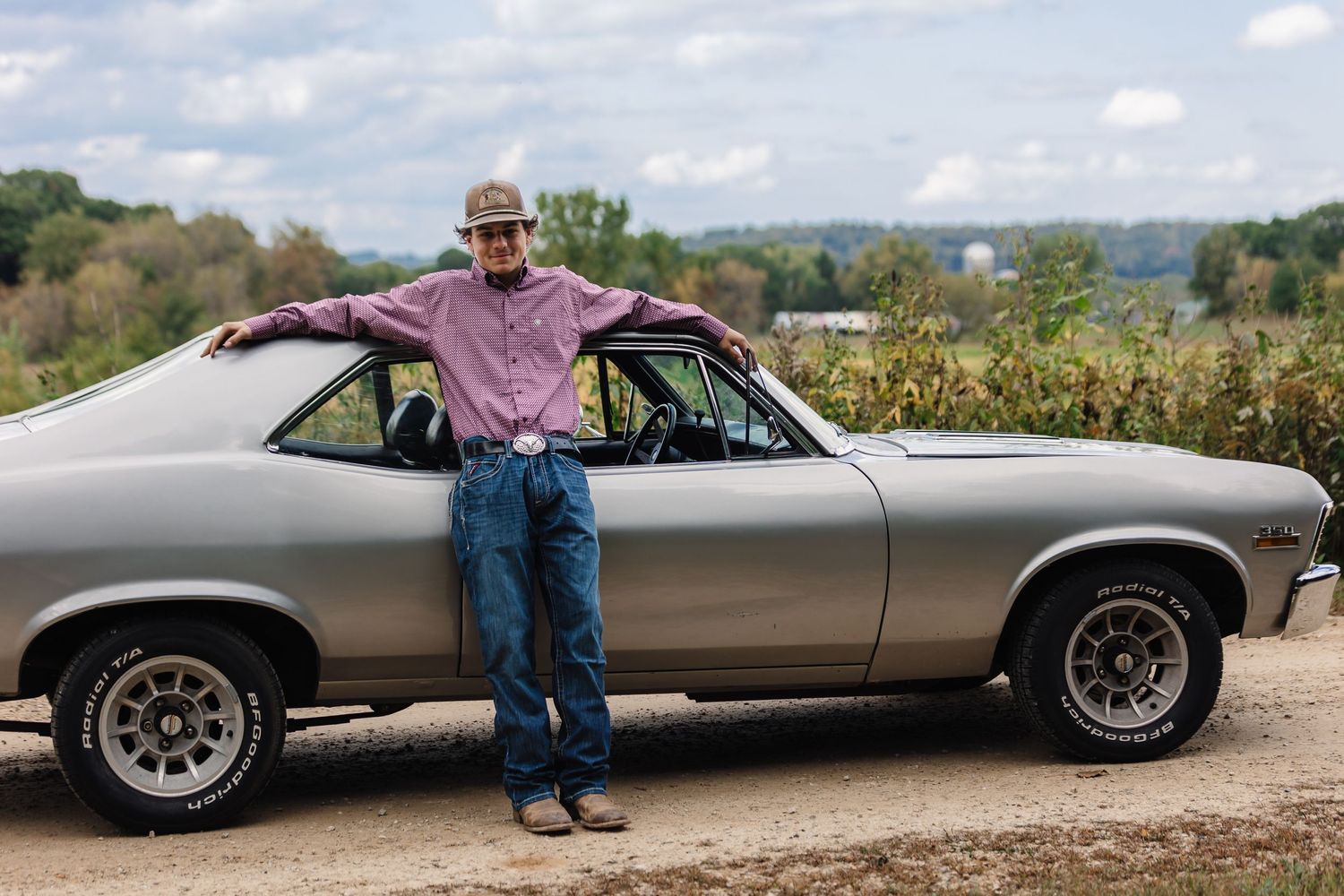 Senior Leaning against car