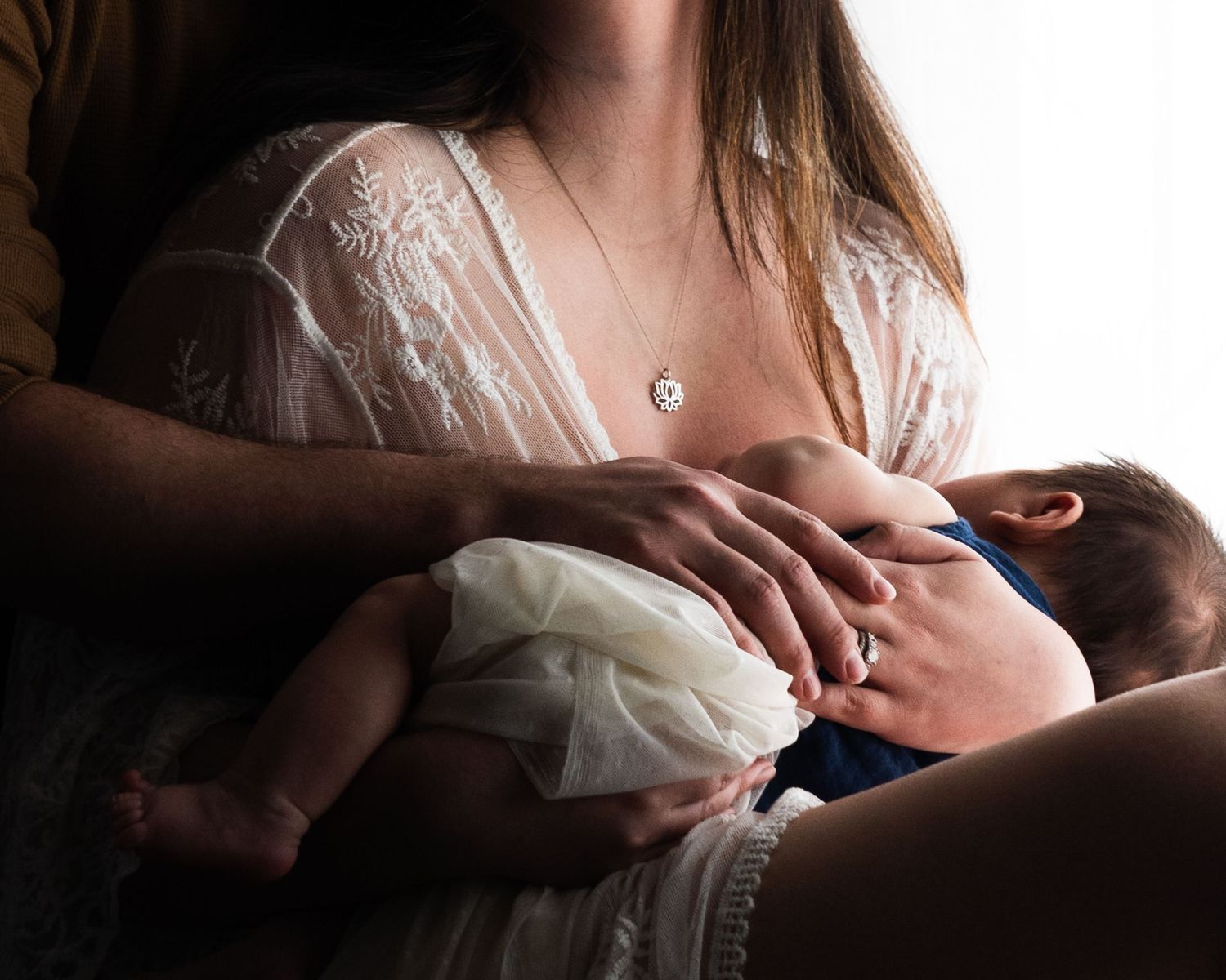 Austin Texas and Denver Colorado family photographer photographing a newborn.