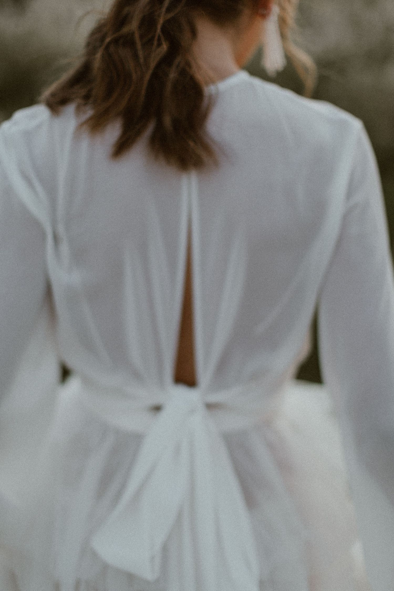 Alegant close-up bridal portrait highlighting delicate makeup and hairstyle