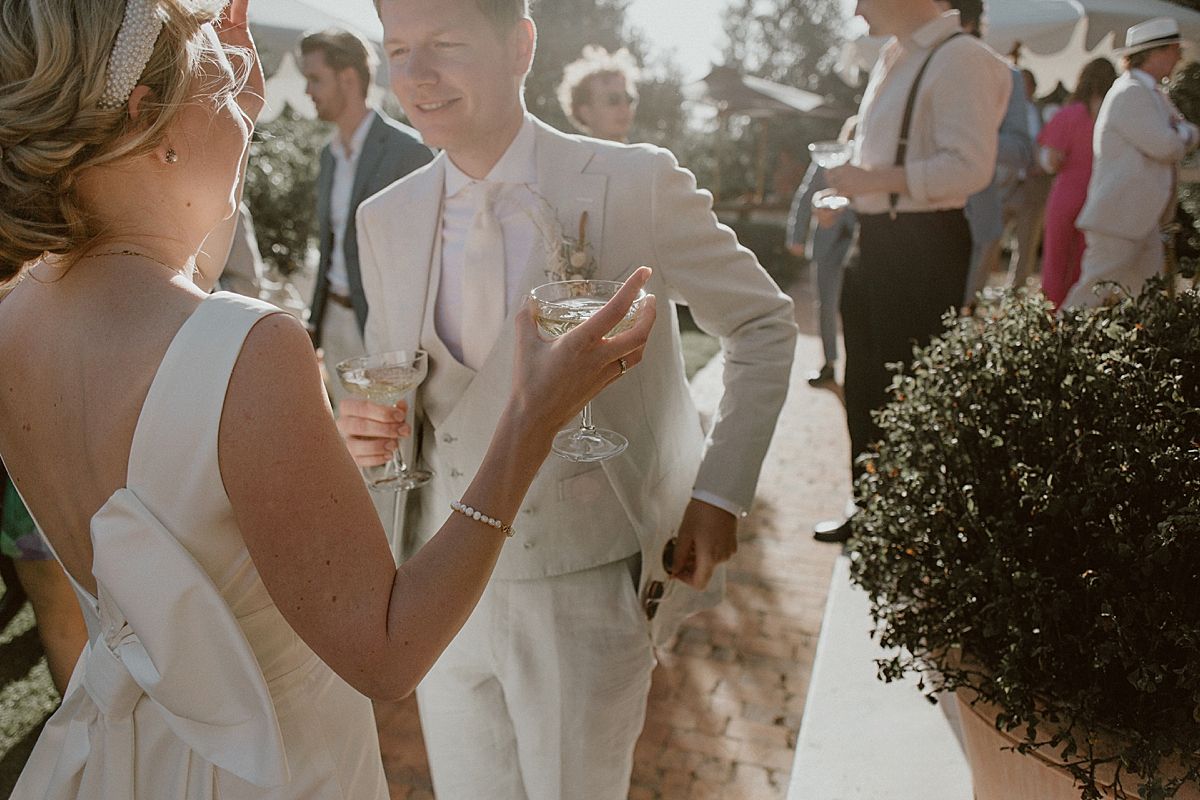 Wedding guests enjoying a relaxed celebration in Penhill Farm gardens